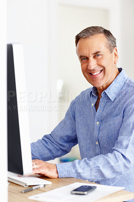 Buy stock photo Mature man at desk with computer, portrait and happy networking on email, typing and planning budget. Smile, paperwork and senior businessman in office with invoice, bills and online business audit.