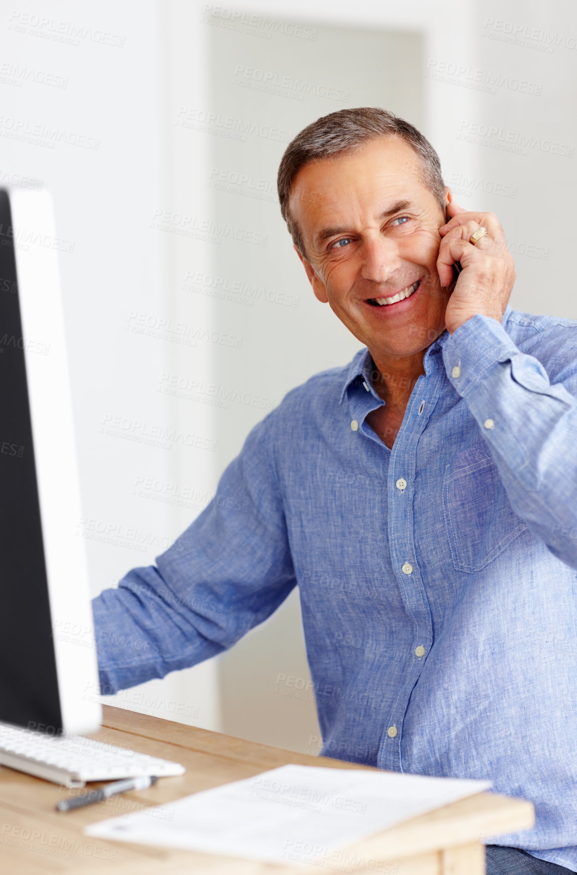 Buy stock photo Mature man at desk with computer, phone call and networking for happy business negotiation. Cellphone, discussion and senior businessman in office with smile, conversation and connection with deal.