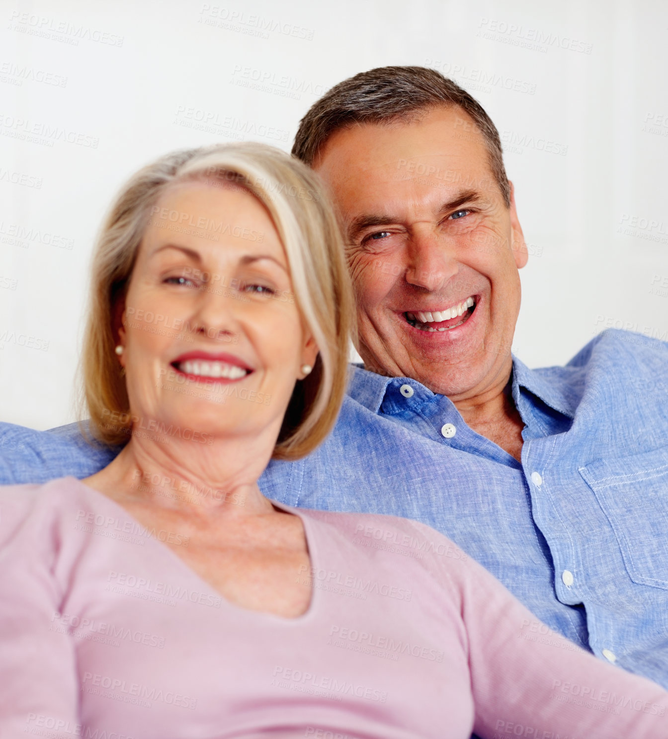 Buy stock photo Senior, couple and portrait or happy on sofa with support, relationship and marriage in retirement home. Elderly, man and woman with smile on couch in living room with trust, care and love in house 