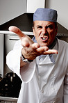 An angry chef shouting at you by standing in front of vent hood