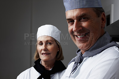 Buy stock photo Closeup portrait of a happy male and female chefs smiling