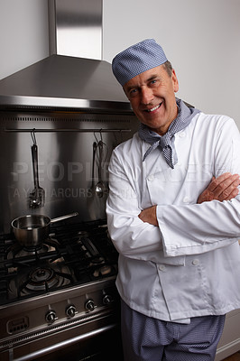 Buy stock photo Man, smile and chef with arms crossed in kitchen for cooking, hospitality or culinary professional. Mature person, portrait and happiness at hotel restaurant for dinner cuisine, menu or service