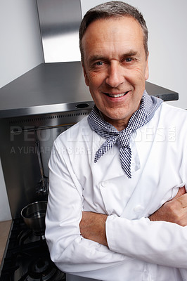 Buy stock photo Man, portrait and chef with arms crossed in kitchen for cooking, hospitality or culinary professional. Mature person, smile and happiness at hotel restaurant for dinner cuisine, menu or service