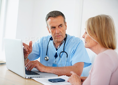 Buy stock photo Doctor, consultation and showing laptop to patient for diagnosis search, trust and healthcare in clinic. Gynecologist man, woman and computer for check pap smear results, online advice and discussion