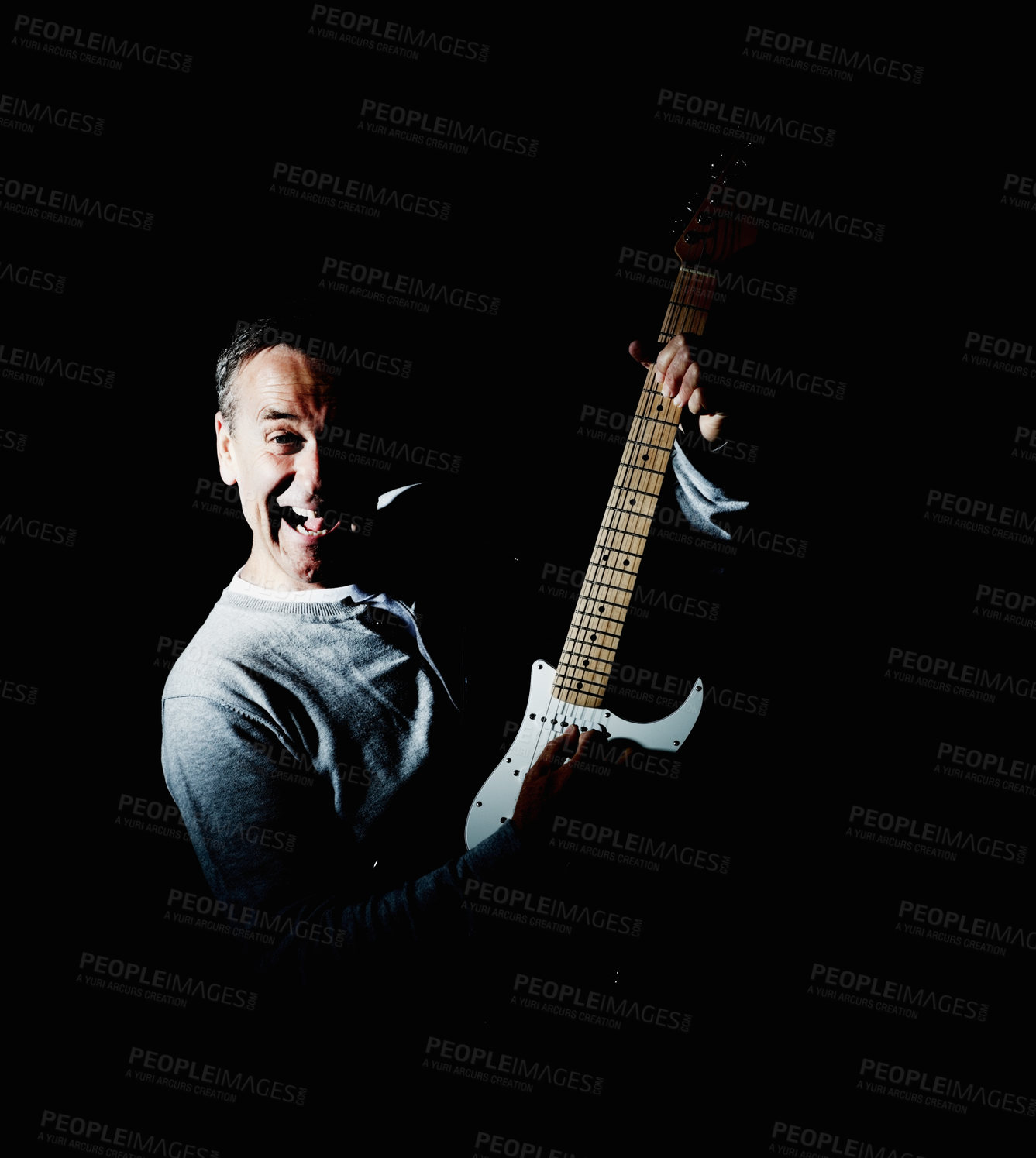 Buy stock photo Mature, guitar or portrait of happy man in studio performance for rock, artist or concert in dark. Black background, creative person and excited musician playing instrument with song or crazy skills