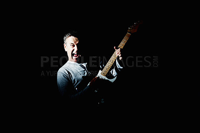 Buy stock photo Excited, guitar or mature man in studio performance for rock music, artist or concert on black background. Creative person, dark or crazy musician playing instrument with song, wild skills or hobby