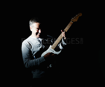 Buy stock photo Smile, guitar or mature man in studio performance for rock music, artist or concert on black background. Creative person, dark or happy musician playing electric instrument with song, skills or hobby