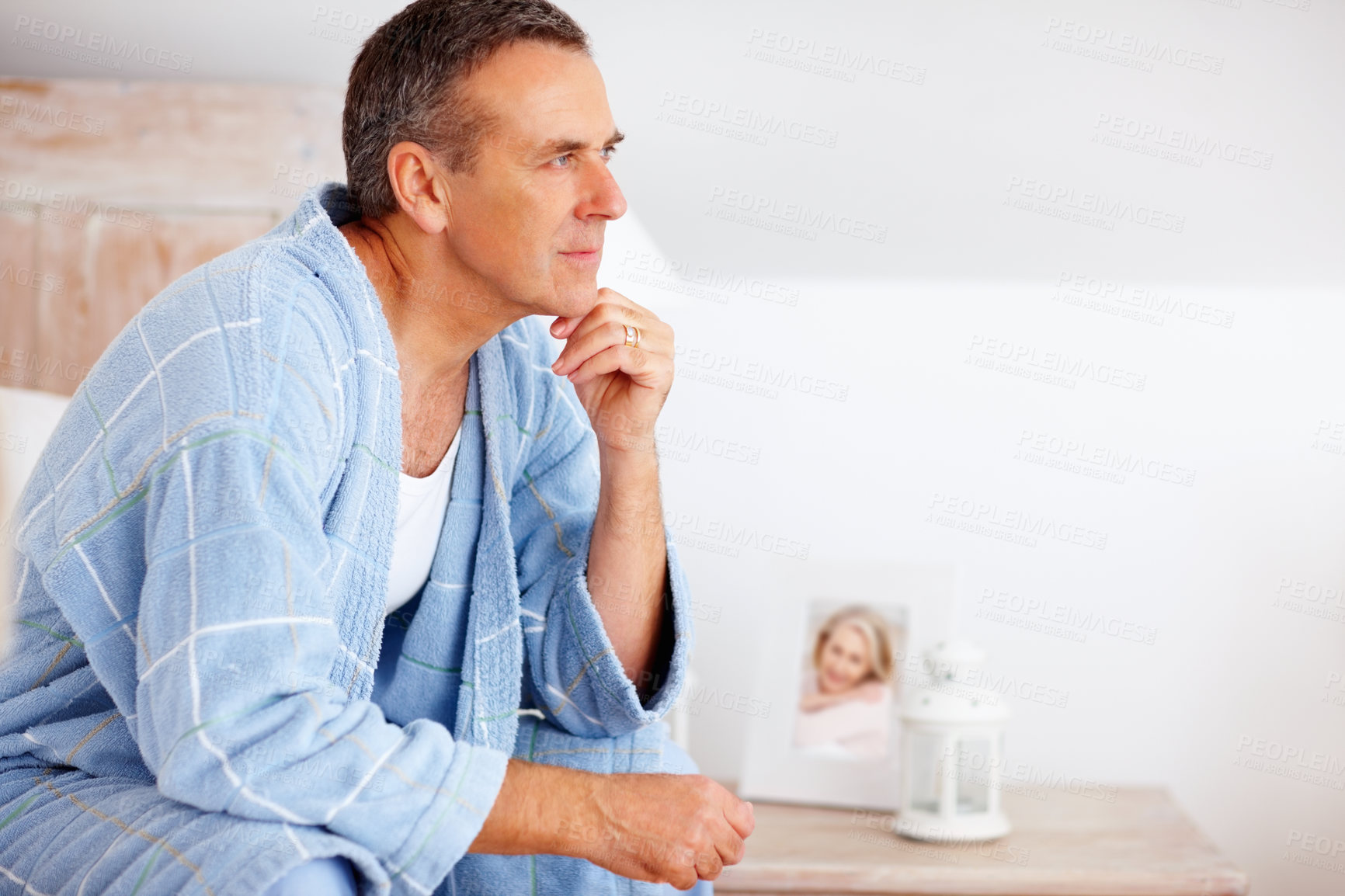 Buy stock photo Idea, relax and mature man in bedroom at nursing home for dementia symptoms with treatment. Thinking, memory loss and senior male person with reflection for past on bed at house in Australia.