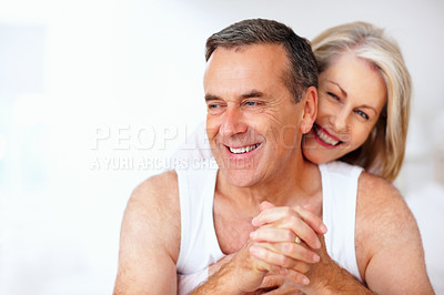 Buy stock photo Mature, laughing or happy couple hug in house bedroom together to relax on holiday for bonding or support. Embrace, funny or romantic man and senior woman with love, smile or care on white background