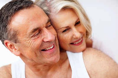 Buy stock photo Face smile, mature couple and hug for support, healthy relationship, bonding together with trust in home. Happy woman, man and closeup love embrace with safety, calm weekend and marriage commitment