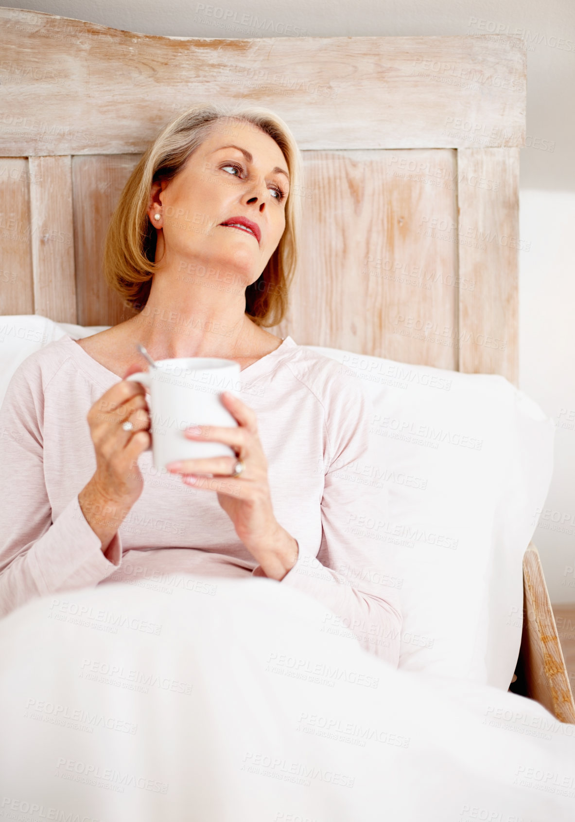 Buy stock photo Senior woman, home and drinking tea in bedroom for relax or comfort on weekend with break, rest and reflection. Elderly, female person and remembering in thinking, morning routine and memory in house