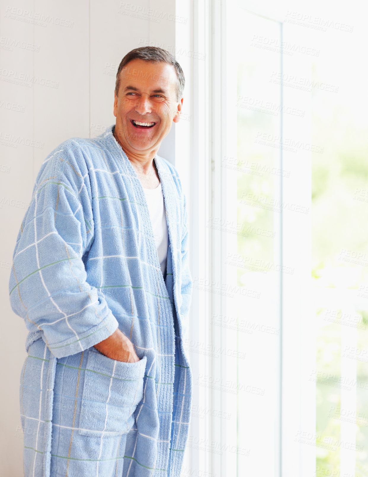 Buy stock photo Senior man, happy and relax in home with mockup, retirement peace and mindfulness or wellness in weekend. Mature male person, smile and thinking with pyjamas, space and wake up for calm morning