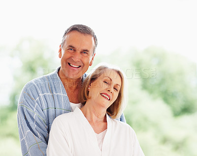 Buy stock photo Portrait, love and window with mature couple, hug and support in living room of house together. Smile, face and trust with happy, senior man and woman bonding while enjoying retirement at home