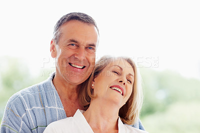 Buy stock photo Portrait, hug and bathrobe with senior couple, love and support in living room of house together. Smile, face and trust with happy, mature man and woman bonding while enjoying retirement at home