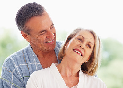 Buy stock photo Mature couple, happy and hug outdoor on holiday for retirement, leisure and wellness with bonding. Man, woman and anniversary celebration at hotel with smile on vacation for peace, health and love