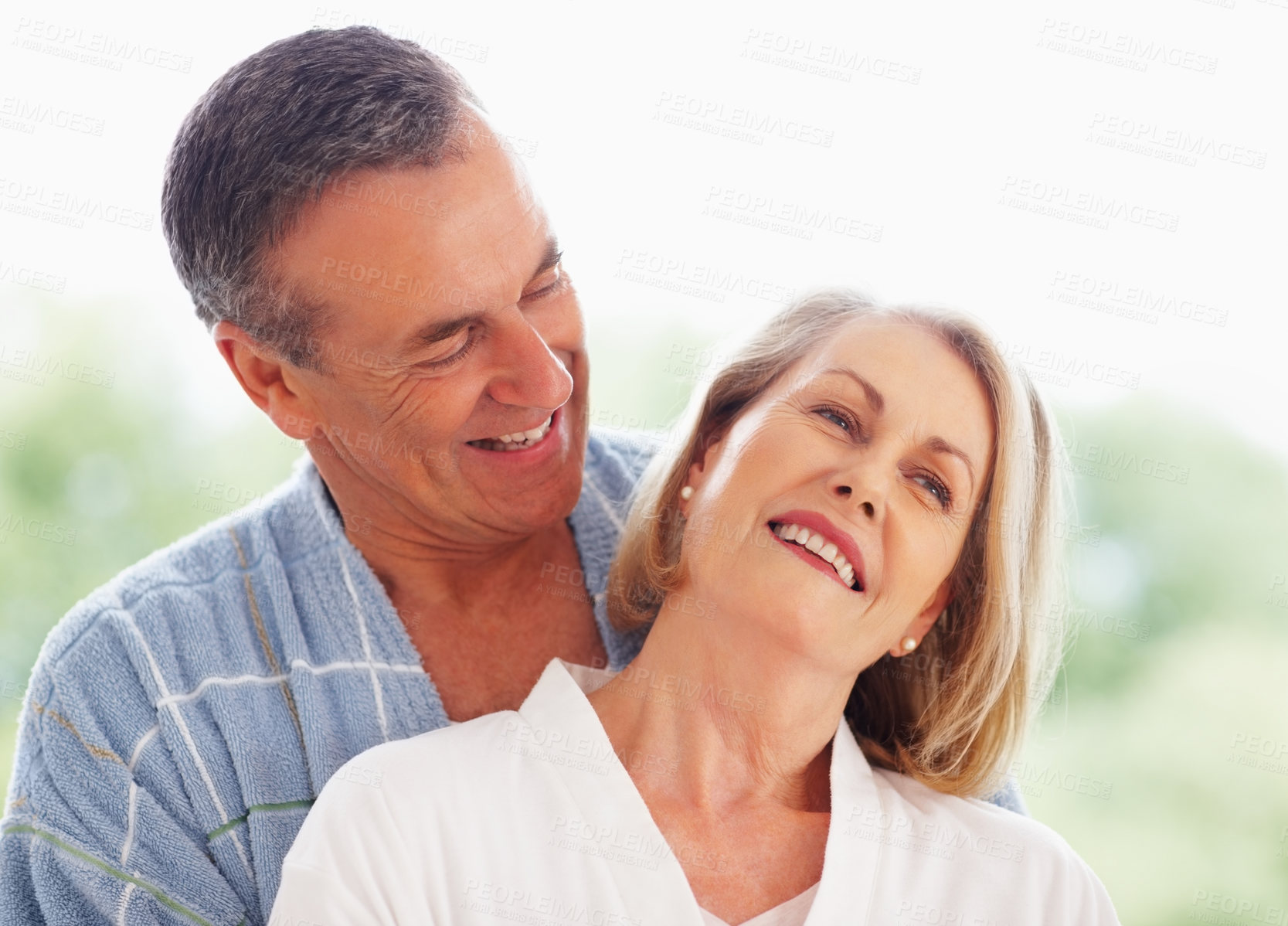 Buy stock photo Mature couple, happy and hug outdoor on holiday for retirement, leisure and wellness with bonding. Man, woman and anniversary celebration at hotel with smile on vacation for peace, health and love