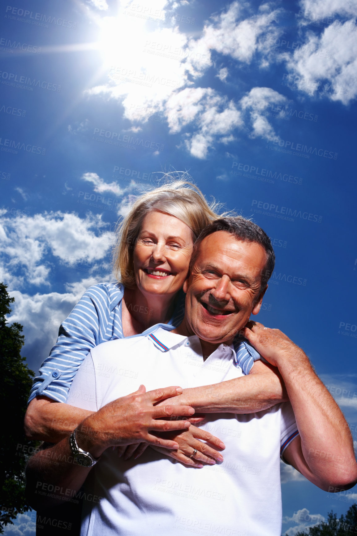 Buy stock photo Portrait, hug and mature couple with blue sky, love and marriage with happiness, romance and joy. Face, outdoor and man with woman, relationship and time together with break, care and trust in park