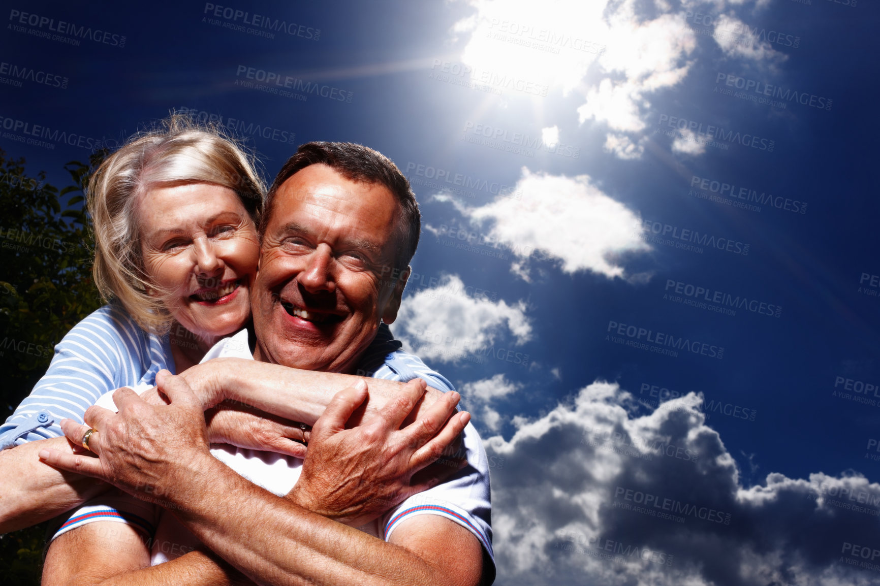 Buy stock photo Portrait, hug and old couple with blue sky, love and marriage with happiness, romance and trust. Face, outdoor and man with woman, relationship and time together with break, care and embrace in park