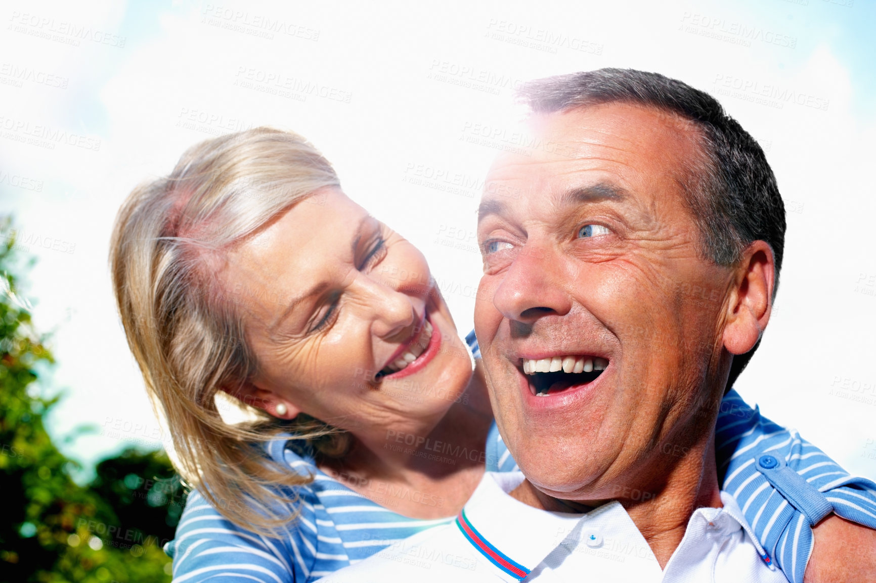 Buy stock photo Mature couple, happy and hug with blue sky in sunshine for love, support or care together in nature. Mature man and woman with smile in embrace for outdoor romance, bonding or holiday weekend at park