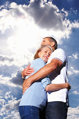 Buy stock photo Low section of happy old couple intimately hugging each other