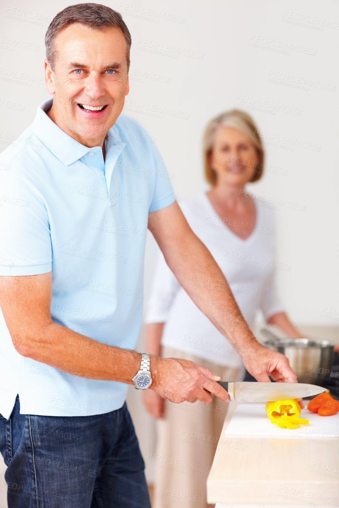 Buy stock photo Portrait, cooking and man cutting peppers in kitchen for anniversary dinner or meal for date with wife. Smile, food and mature male person chop vegetable for healthy, nutrition or diet supper at home