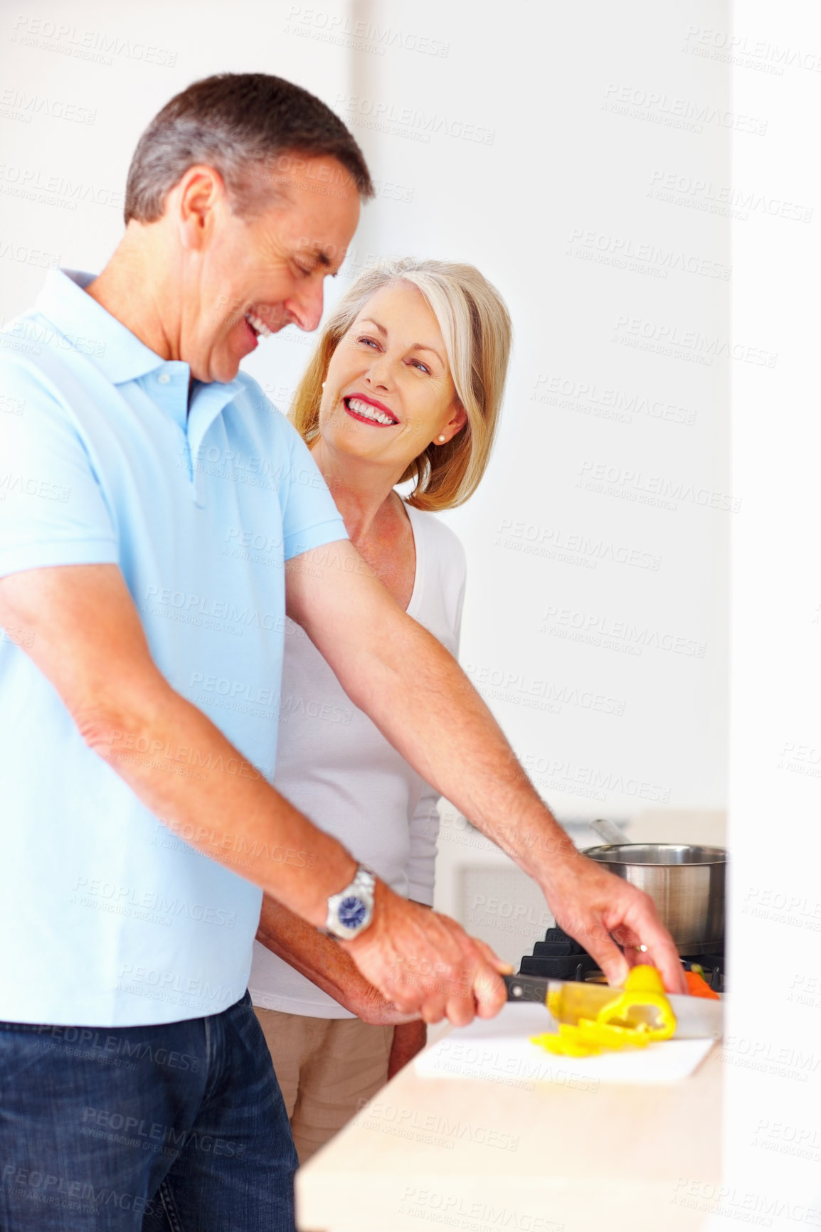 Buy stock photo Mature couple, happy and cooking in kitchen for snack, lunch and nutrition as romantic partner. Woman, man and meal preparation for bonding, relationship and together in home for diet, health or care