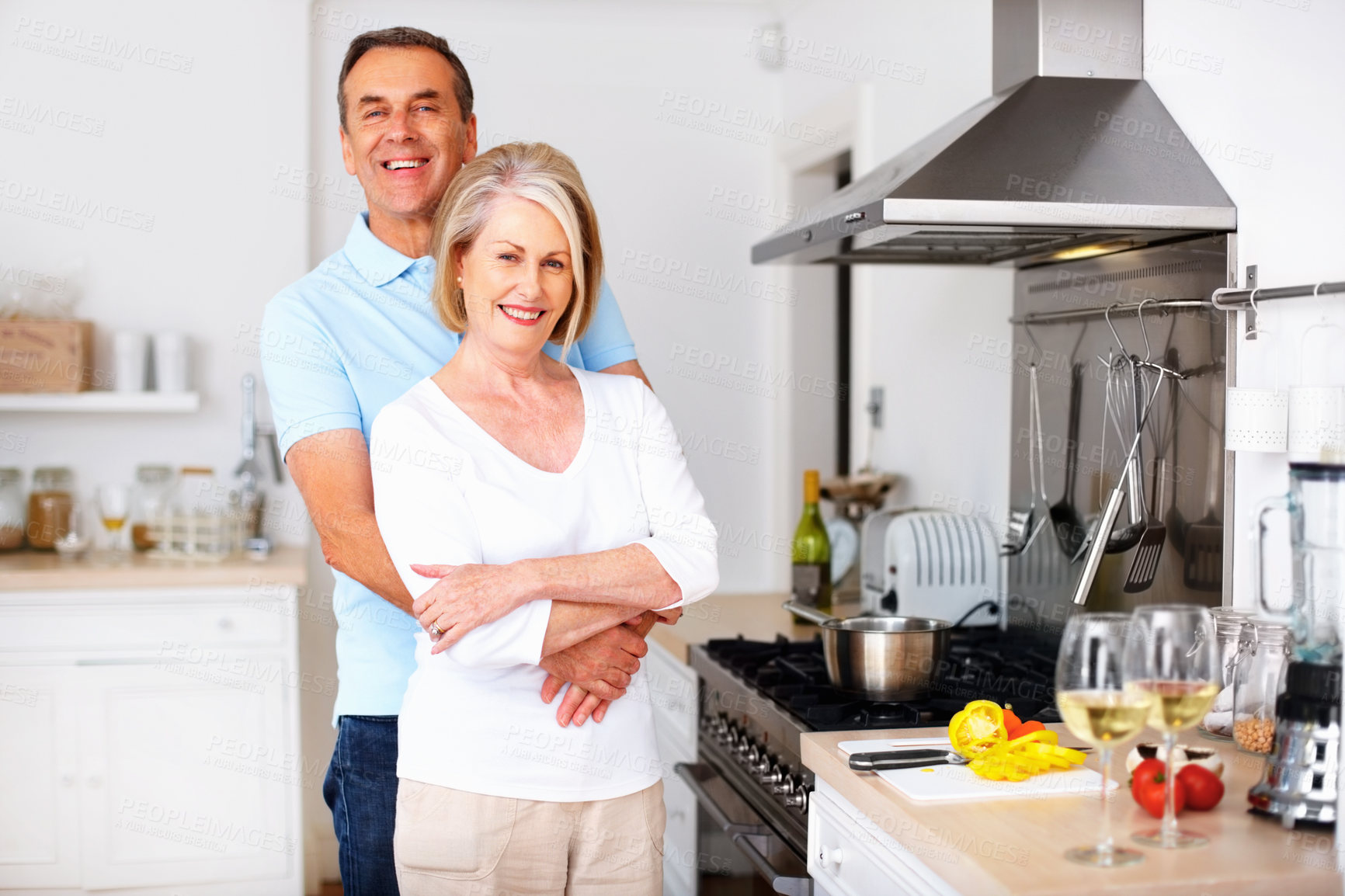 Buy stock photo Senior couple, happy and portrait in kitchen for snack, lunch and nutrition as romantic partner in love. Woman, man and retirement in bonding, relationship or together in home for hug, health or care