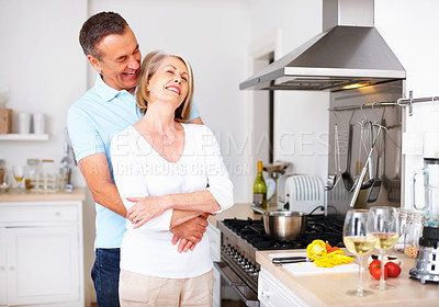 Buy stock photo Mature couple, happy and embrace in kitchen for snack, lunch and nutrition as romantic partner. Woman, man and love with romance in bonding, relationship and together in home for diet, health or care