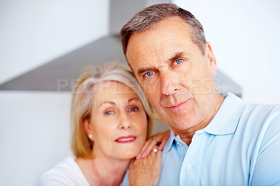 Buy stock photo Mature couple, love and together for care and support, romance or closeup in home. Marriage, face or relax for bonding in retirement for man or female person in England,  smile and portrait in house
