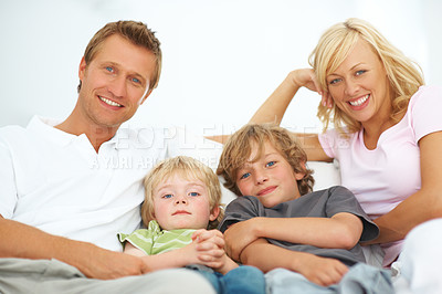 Buy stock photo Portrait, smile and family in home together, bonding and relax, care or support on living room sofa. Happy face, parents and children in house lounge on couch with love for kids, father and mother