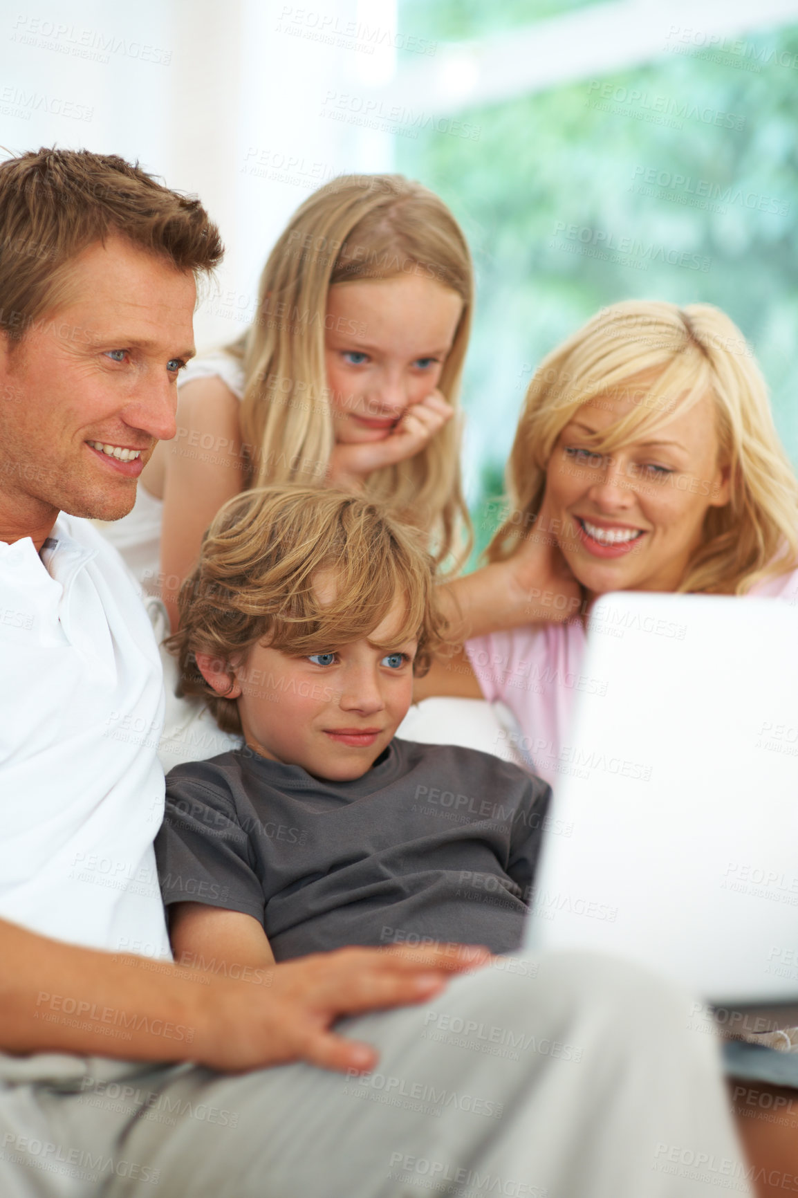 Buy stock photo Laptop, video or streaming with a family on a sofa in the living room of their home together for entertainment. Parents, children or computer for service subscription with a mother, father and kids