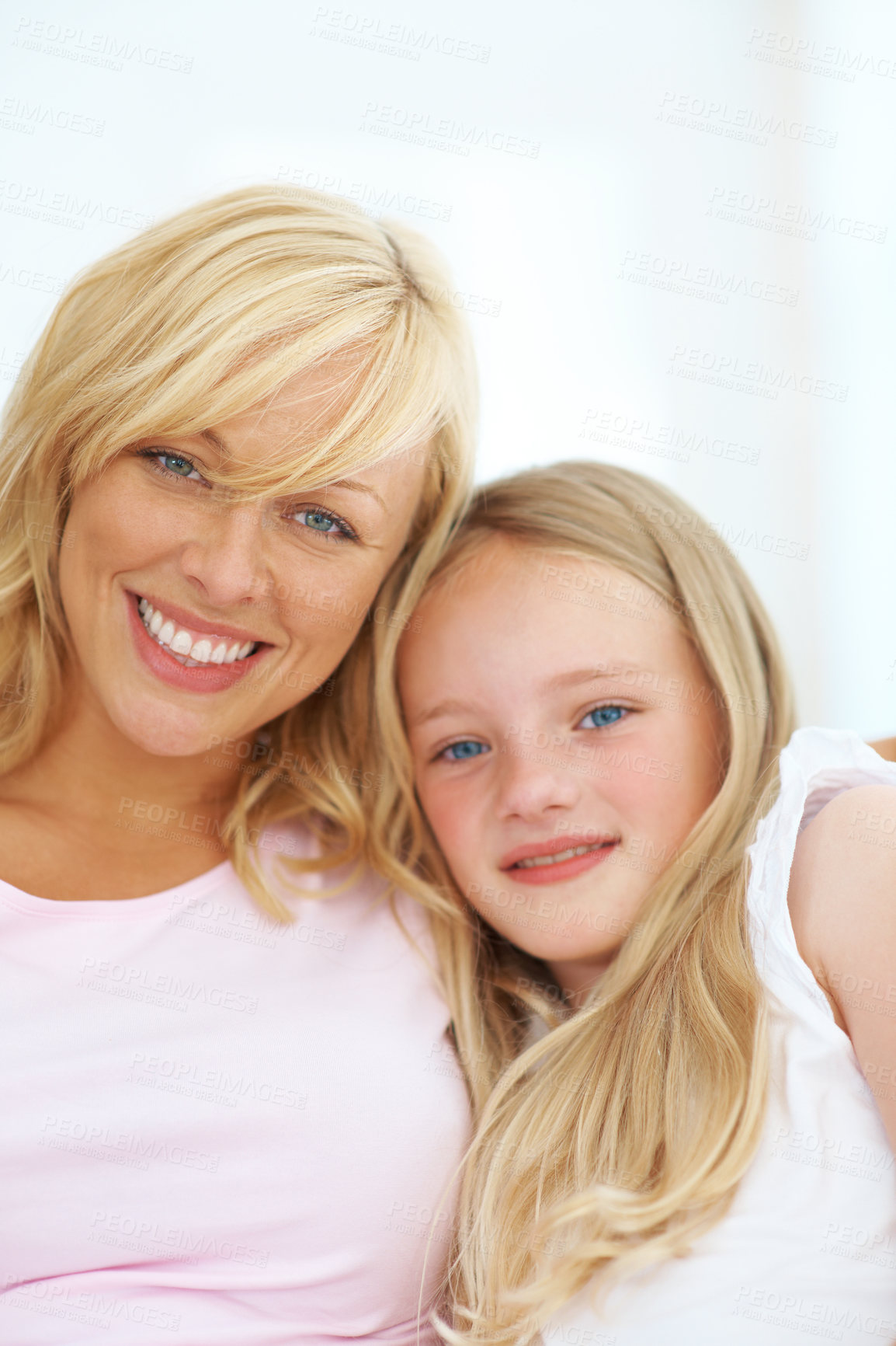 Buy stock photo Smile, portrait and mother with girl child sitting in the living room for bonding together at home. Excited, embracing and young mom relaxing with kid daughter on a sofa in the lounge of apartment.