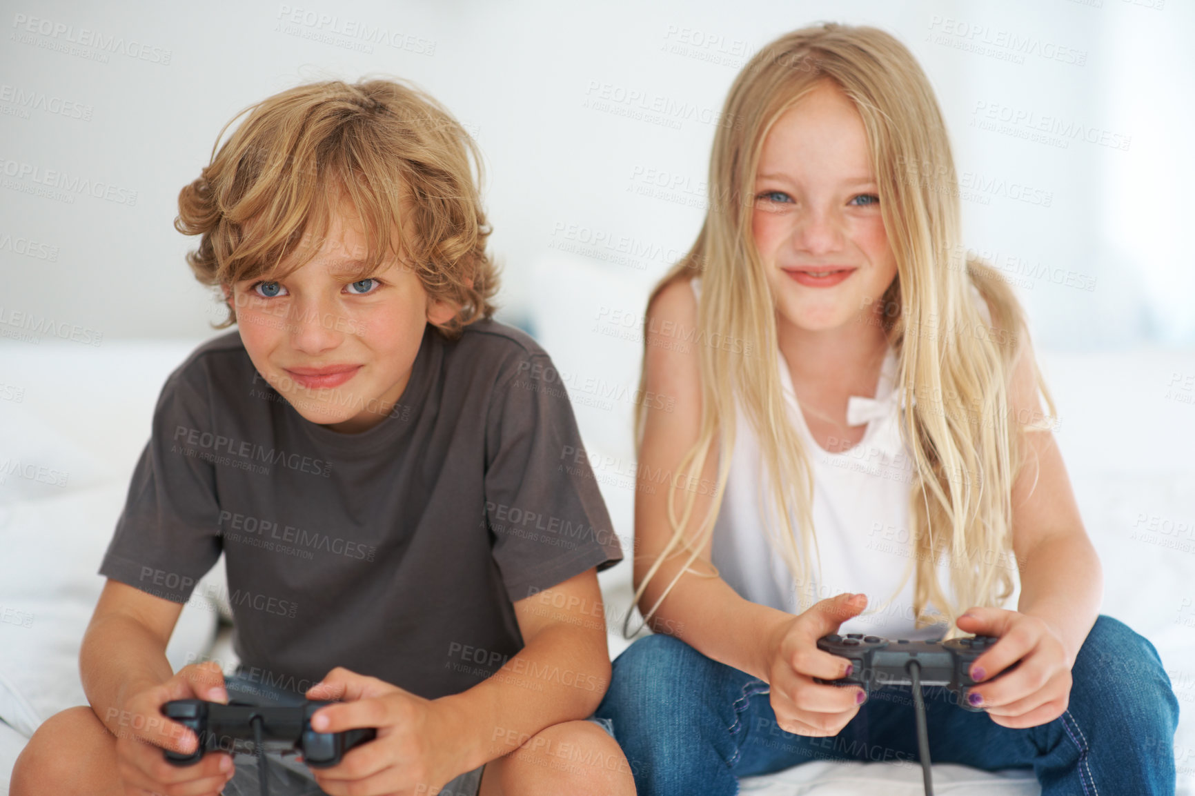 Buy stock photo Smile, children playing video game on sofa or portrait  together in home living room for competition. Happy kids,  brother and sister on controller technology, family entertainment and bond in house