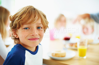 Buy stock photo Kid, breakfast and portrait at home in the morning with food, smile and happy from eating. Family, dinner table and hungry young child with meal for health and nutrition in a house with juice