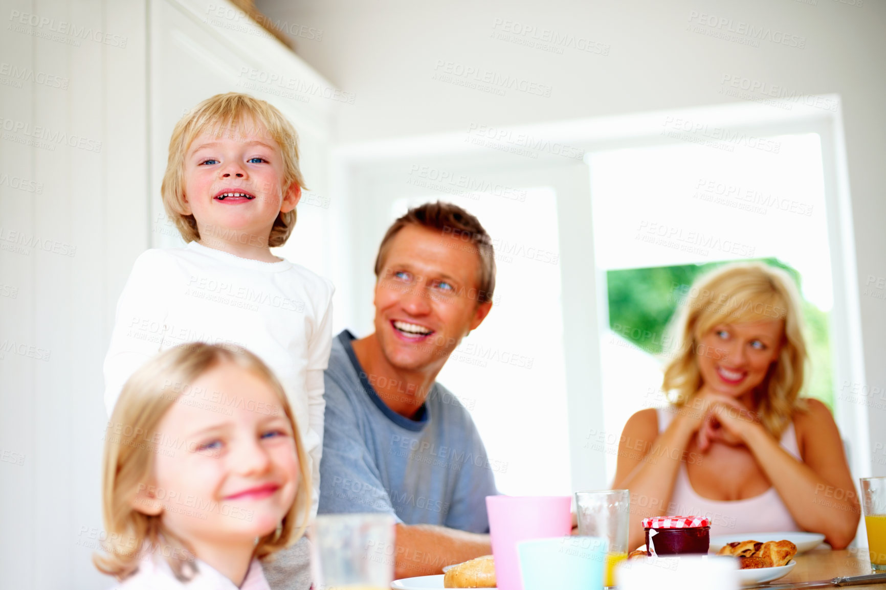 Buy stock photo Happy family, portrait and breakfast at table in home with children and parents together in morning. Healthy, food and brunch with kids, mom and dad with nutrition or diet for energy and wellness