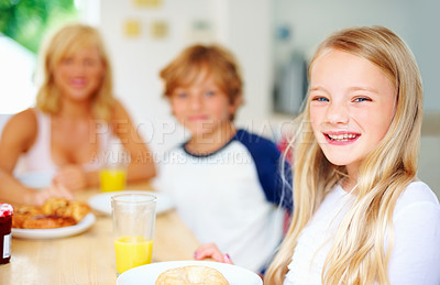 Buy stock photo Happy family, morning and breakfast in portrait, smiling and eating for nutrition, orange juice and bagel. Mother, children and enjoying food together for hunger, health and energy for good day