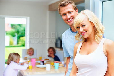 Buy stock photo Happy family, breakfast and portrait at table in home with parents and children eating in morning. Healthy, food and brunch with kids, mom and dad with nutrition or diet for energy and wellness