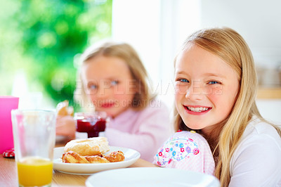 Buy stock photo Smile, kitchen and portrait of children with breakfast together for healthy, wellness and diet meal. Happy, kids and siblings bonding and eating lunch or brunch by wooden table at modern family home.