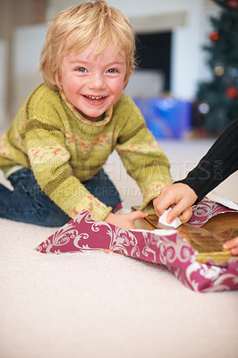 Buy stock photo Portrait, boy and opening christmas presents for holiday, happy and excited for gift. Celebration, smile and family home with decorations, tradition and joy for santa claus or childhood memories