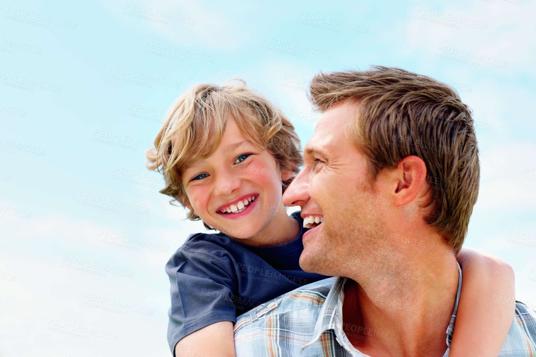 Buy stock photo Father, son and smile outdoor with piggyback for bonding, relationship and freedom with blue sky in nature. Family, man and boy child with playing, care and love for excitement, peace and support