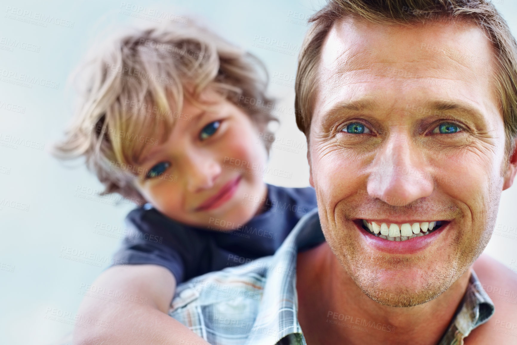 Buy stock photo Father, son and portrait or smile with piggyback for bonding, relationship and freedom with blue sky in nature. Family, man and boy child with playing, care and love for happiness, peace and support