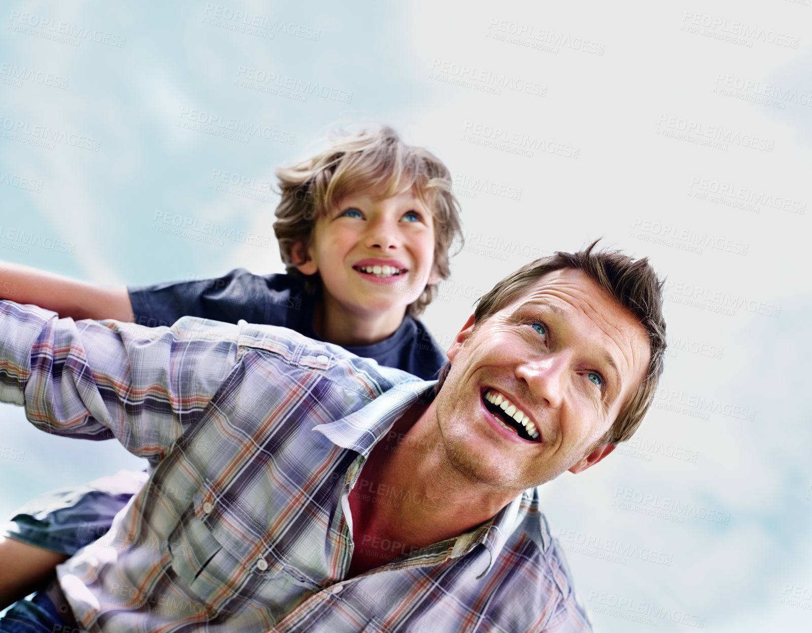 Buy stock photo Father, son and smile outdoor with piggyback for bonding, relationship and freedom with blue sky in nature. Family, man and boy child with playing, care and love for happiness, peace and support