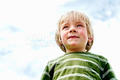 Buy stock photo Boy, outdoor and kid with smile, thinking and sky background with fun, playful and weekend break. Person, childhood and toddler with happiness, freedom and outside with sunshine, peace and summer