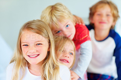 Buy stock photo Portrait, happy or love with brother and sister sibling children on a bed in their home together. Family, smile or bonding with young boy and girl kids in the bedroom of an apartment on the weekend