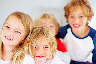 Buy stock photo Portrait, smile or happy children with brother and sister siblings on a bed in their home together. Family, love or bonding with young boy and girl kids in the bedroom of an apartment on the weekend