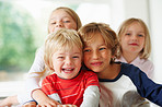 Cheerful little boy with his brother and sisters