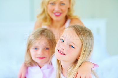 Buy stock photo Smile, portrait and mother with children on bed for bonding, relaxing and spending time together. Happy, love and young mom chilling and resting with girl kids from Australia in bedroom of house.