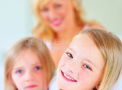 Buy stock photo Happy, smile and mother with kids for bonding, relaxing and spending time together at home. Excited, love and young mom chilling and resting with girl children from Australia in bedroom of house.