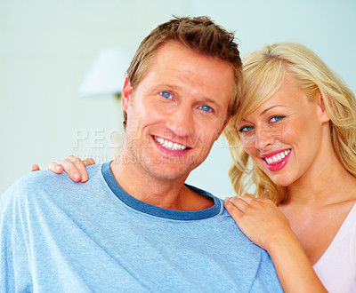 Buy stock photo Love, portrait and couple hug in a house with bonding, care and security in their home together. Smile, face and woman embrace man in a living room with support, trust and romance in vacation freedom