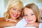 Middle aged woman smiling with her daughter